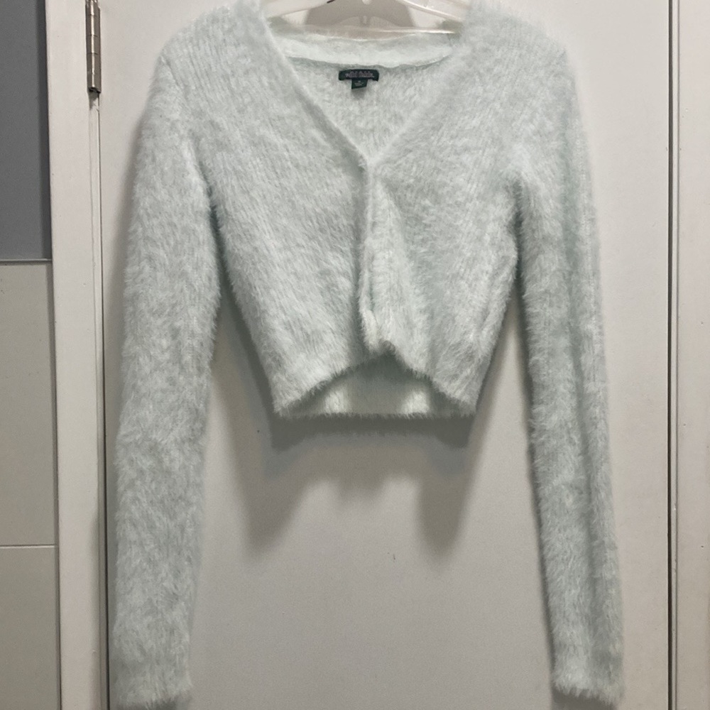 A powder blue sweater and skirt set